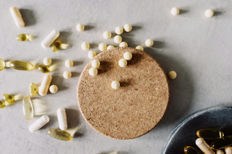 How Individual Therapy Helps People with Drug and Alcohol Addiction 1 Assorted pills and capsules on a marble surface, highlighting healthcare and medicine.